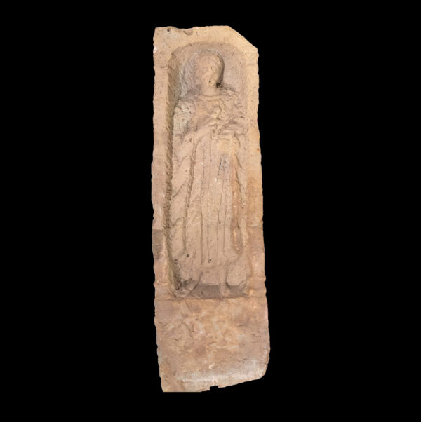 Roman funerary stele of figure with toga and roll