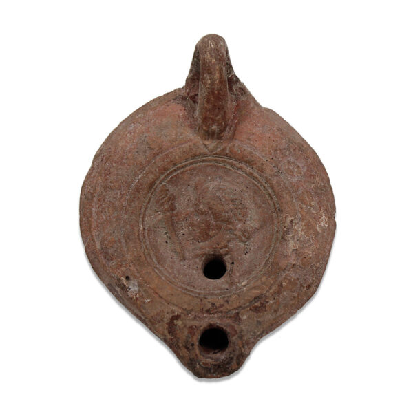 Roman oil lamp with a female head