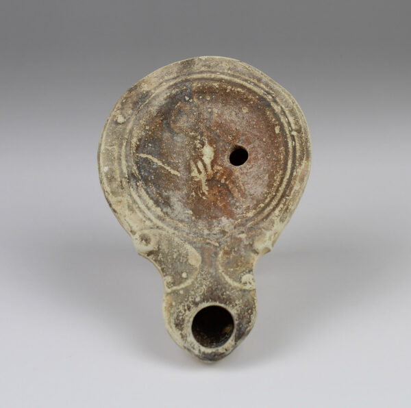 Roman oil lamp with a gladiator