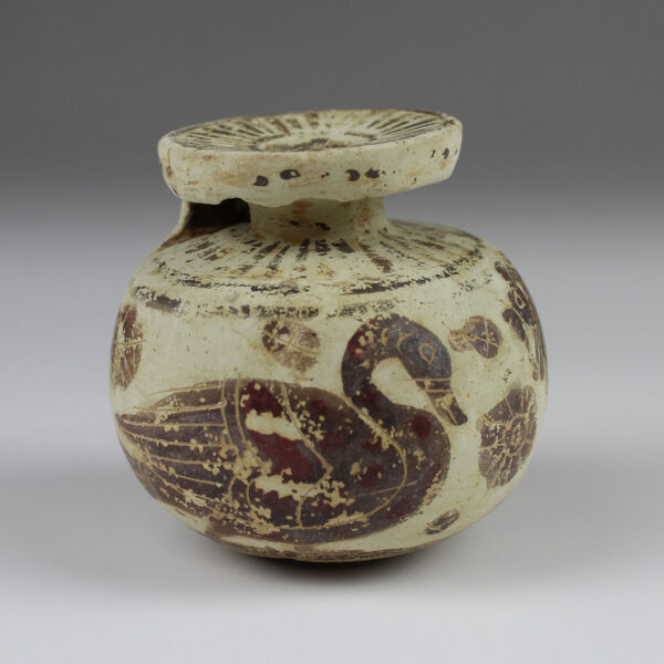 Greek aryballos with swan and lion
