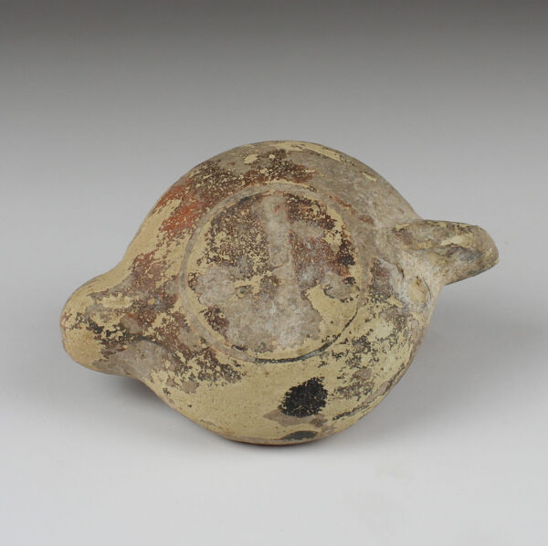 Roman oil lamp with dog