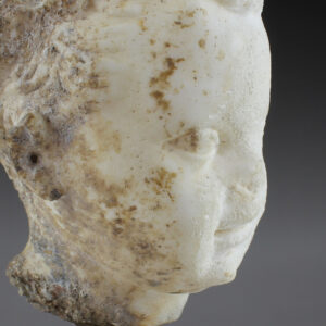 Roman portrait head of a laureated child