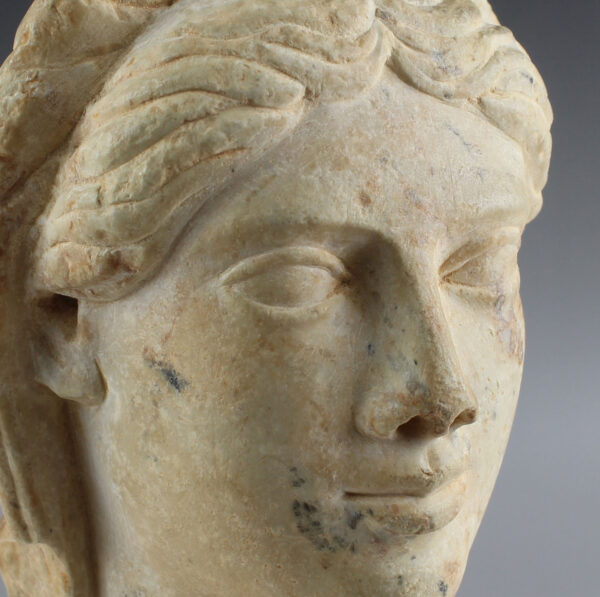 Roman head of a woman with a headdress