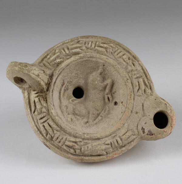 Roman oil lamp with reclining antelope and initials stamp