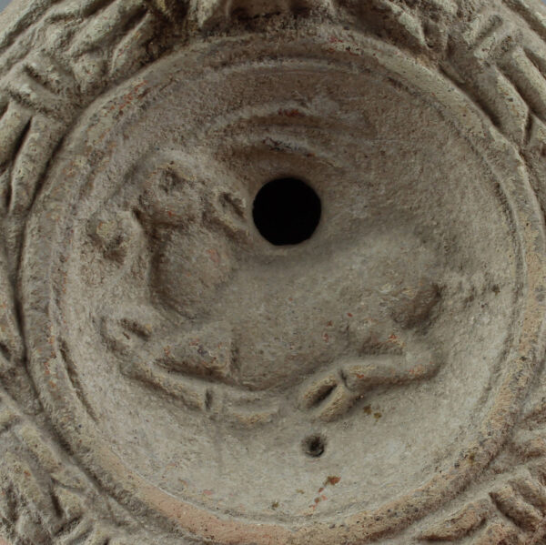 Roman oil lamp with reclining antelope and initials stamp