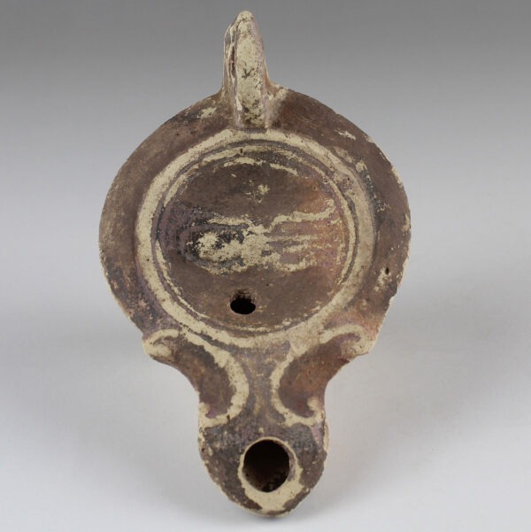 Roman oil lamp with a large cuttlefish (squid or octopus)