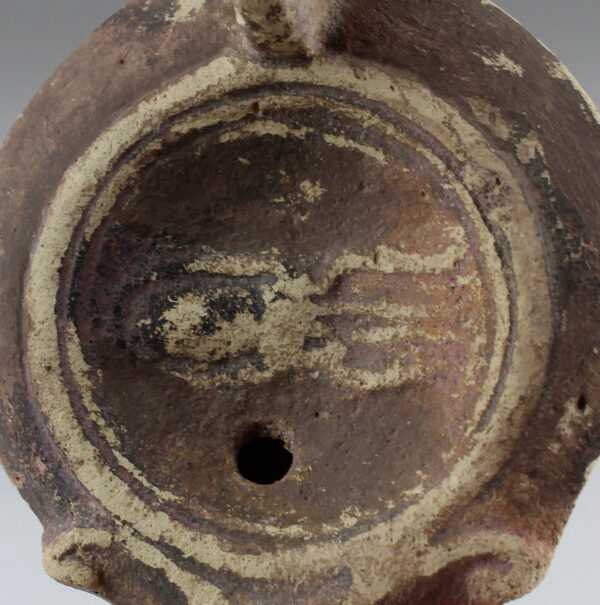 Roman oil lamp with a large cuttlefish (squid or octopus)