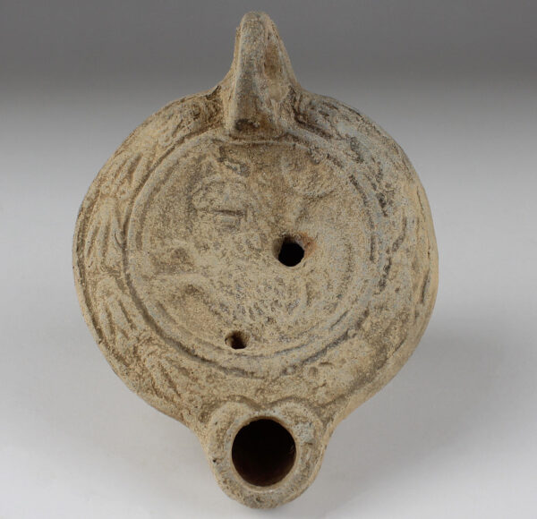 Roman factory oil lamp with hippocampus with a lion’s face