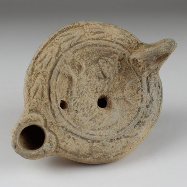 Roman factory oil lamp with hippocampus with a lion’s face