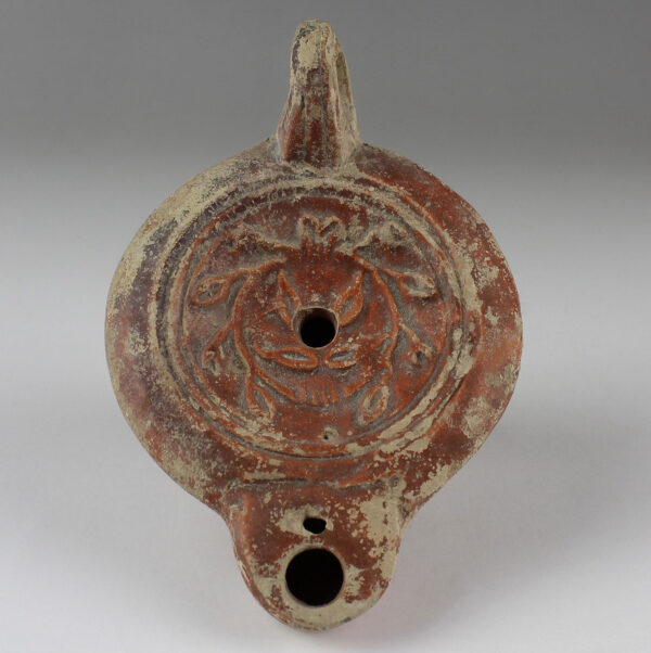 Roman factory oil lamp with wreath of leaves