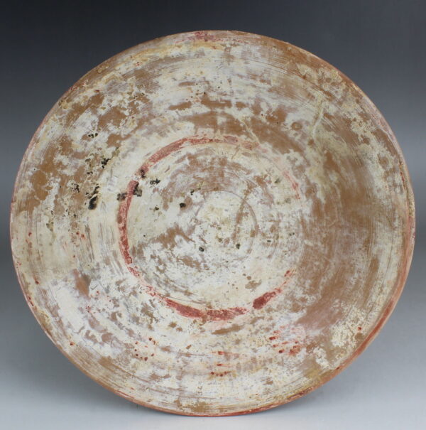 Greek plate with remains of painted decoration