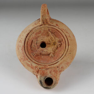 Roman factory oil lamp with a lion and a crocodile