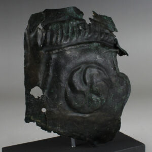 Roman military cheek piece of a helmet fragment with shield ornament