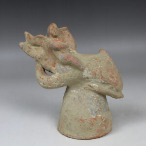Greek figurine of a little Eros riding on a dolphin, holding a lyre
