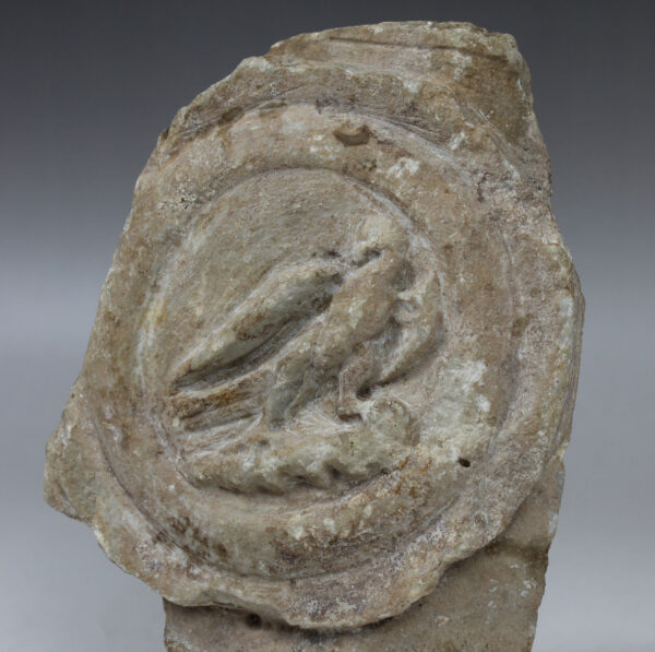 Roman lorica thoracata depicting a medallion with eagle, fragment