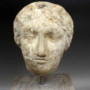 Roman female head reused later as weight
