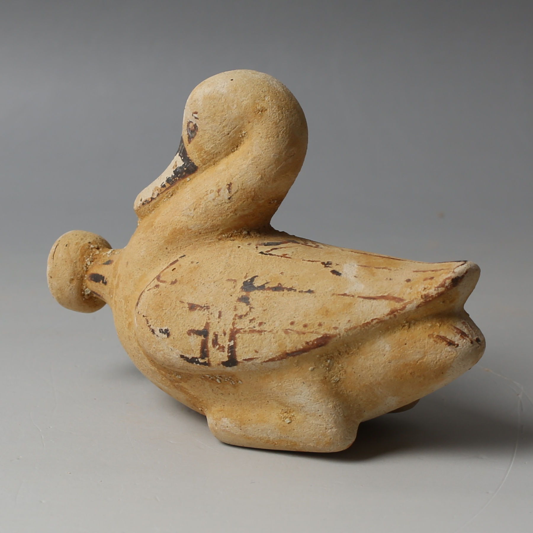 Etrusco-Corinthian aryballos in the shape of swan Etrusco-Corinthian aryballos in the shape of swan