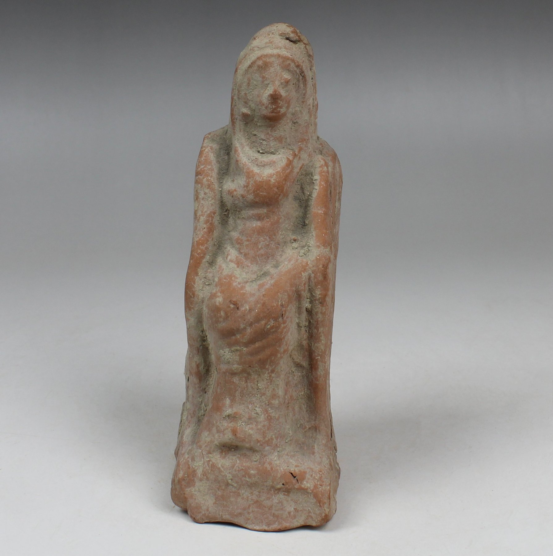 Greek statuette of a seated woman with inscription behind Greek statuette of a seated woman with inscription behind