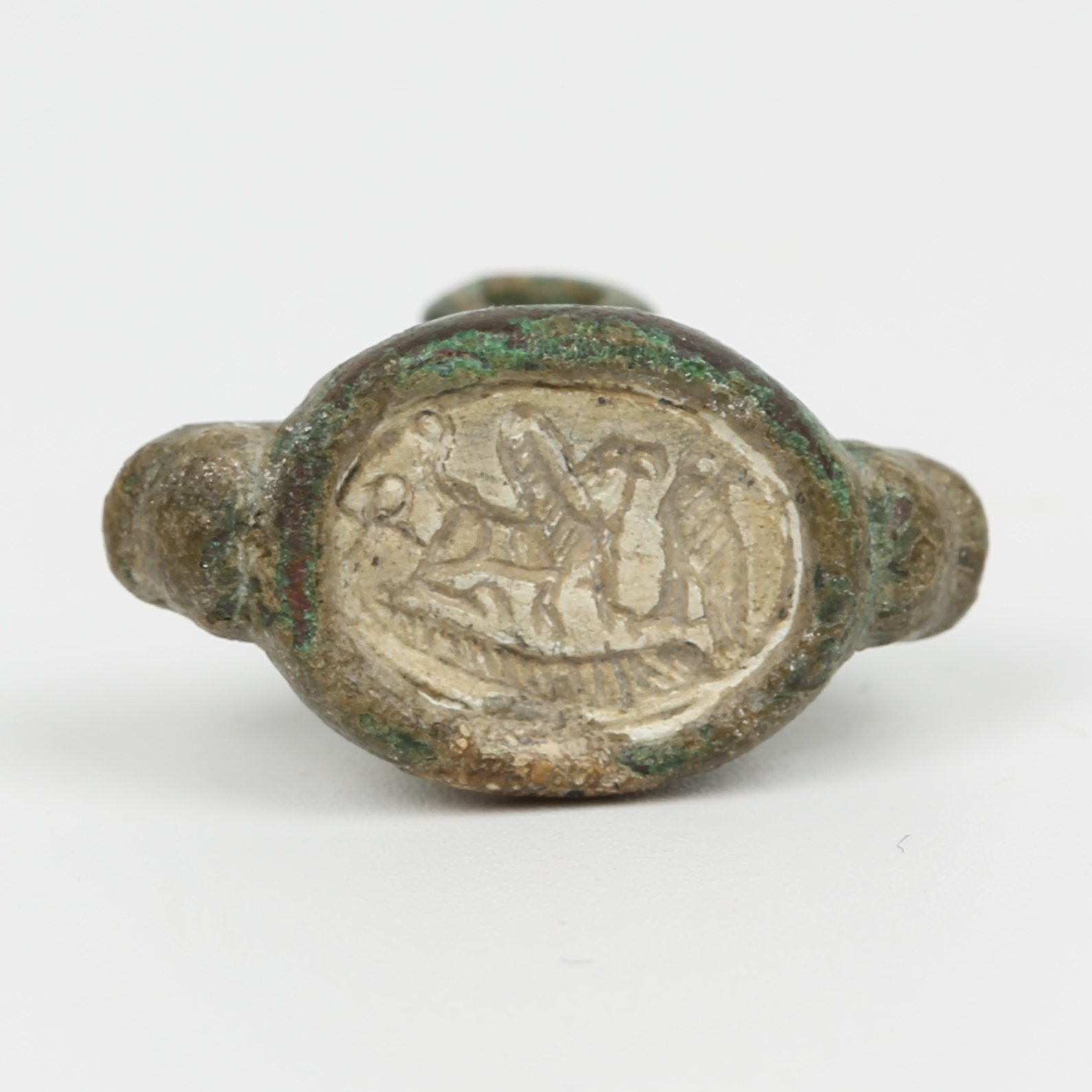 Iron Age seal with bezel ring depicts a griffon, an ankh and a falcon Iron Age seal with bezel ring depicts a griffon, an ankh and a falcon