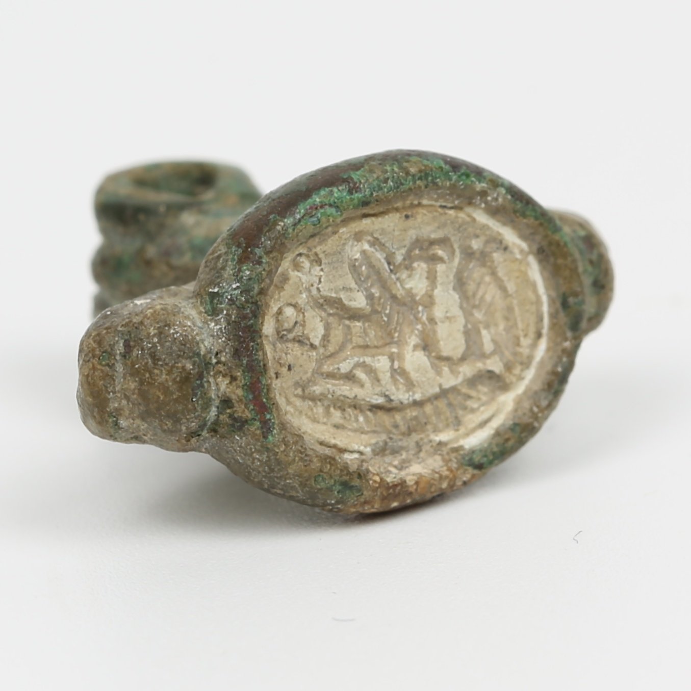 Iron Age seal with bezel ring depicts a griffon, an ankh and a falcon Iron Age seal with bezel ring depicts a griffon, an ankh and a falcon