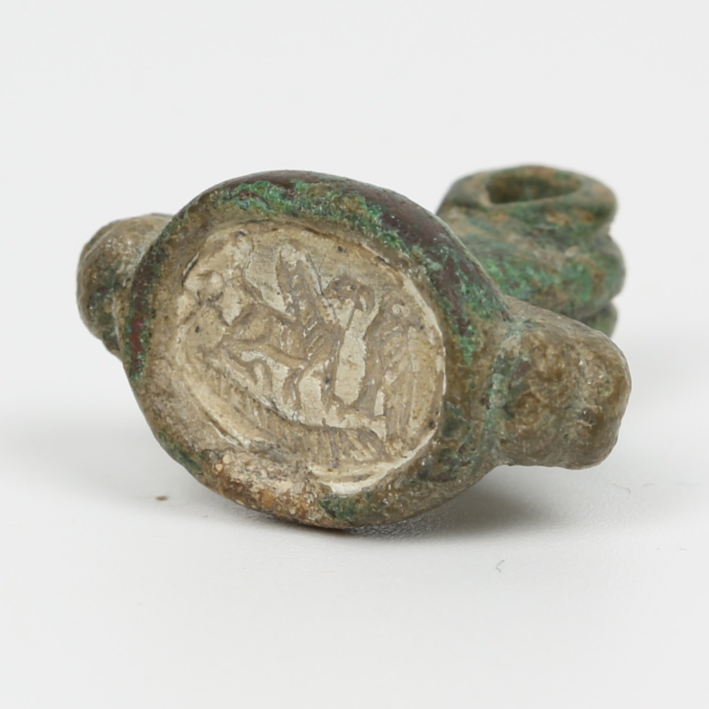 Iron Age seal with bezel ring depicts a griffon, an ankh and a falcon Iron Age seal with bezel ring depicts a griffon, an ankh and a falcon